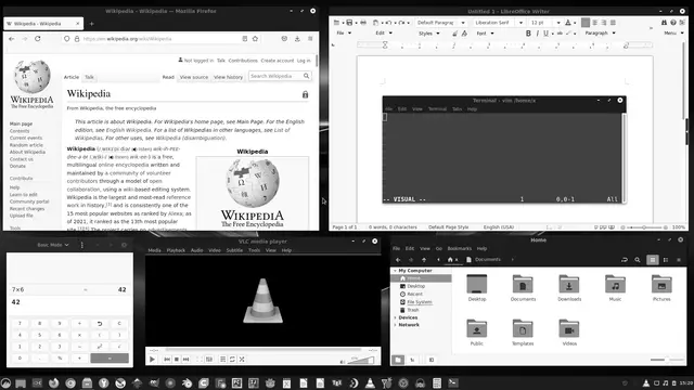 Escritorio de Manjaro Linux con varias aplicaciones de código abierto abiertas